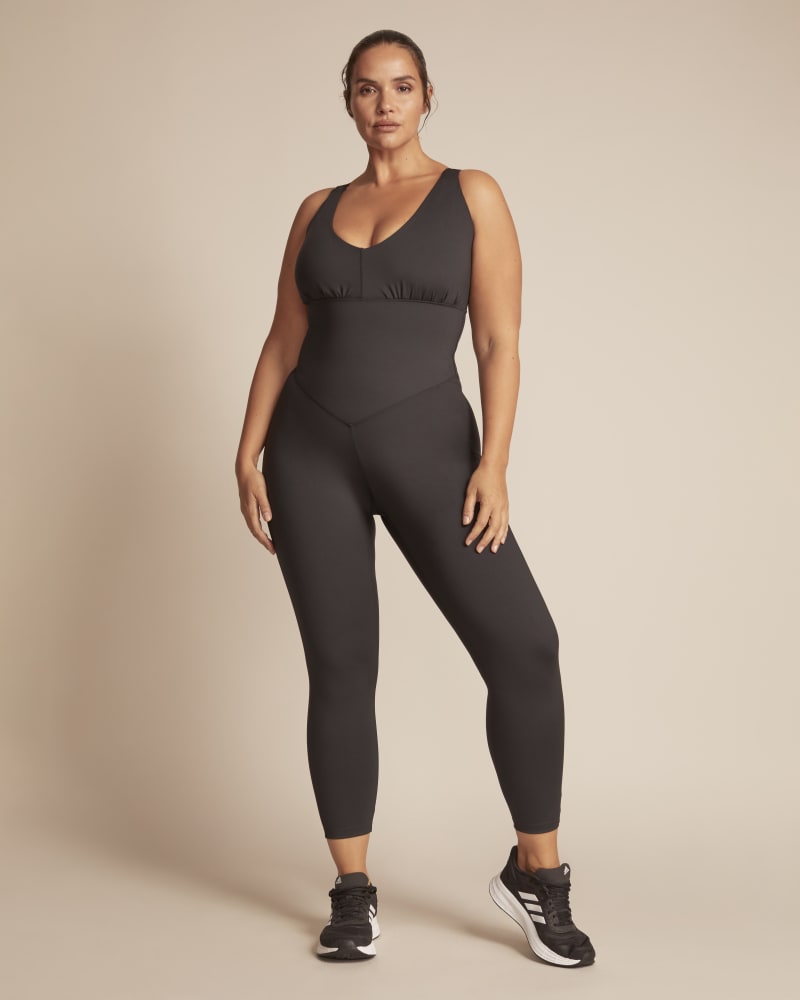 Front of a model wearing a size 1X 11 Honoré x Adidas Onesie in Black by Adidas x 11 Honoré. | dia_product_style_image_id:245749